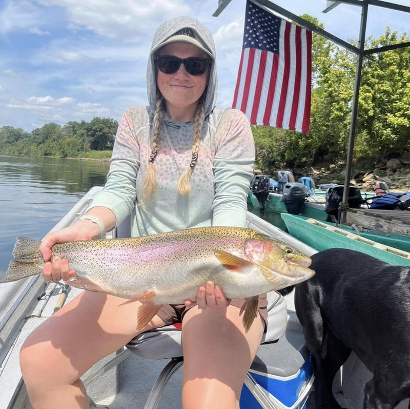 Justine's 9.3 lb rainbow from the White and North Fork confluence in Arkansas, caught on a 3/32 oz black/olive Zig Jig