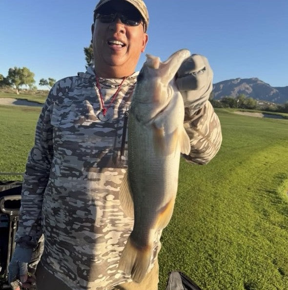 Jerry with an Arizona largemouth bass caught on a 1/32 oz black/chartreuse Zig Jig and a fly rod