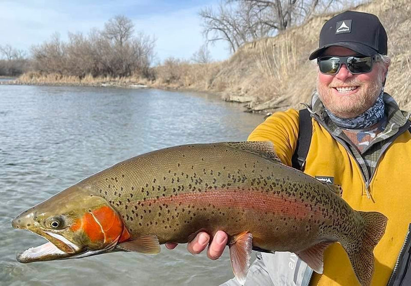 Chris Stinson, owner of Vanilla Gorilla Outdoors in Billings, Montana, with a rainbow trout caught on a Zig Jig