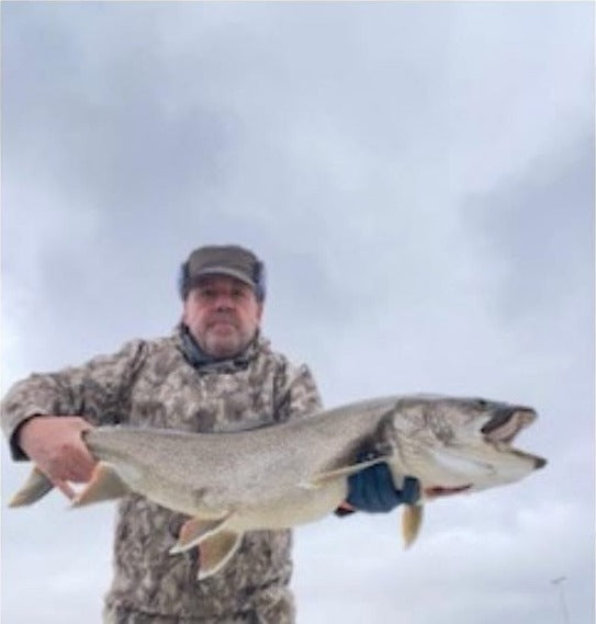 Chris Collett with a lake trout caught on a 1/2 oz Super HD Zig Jig in Utah