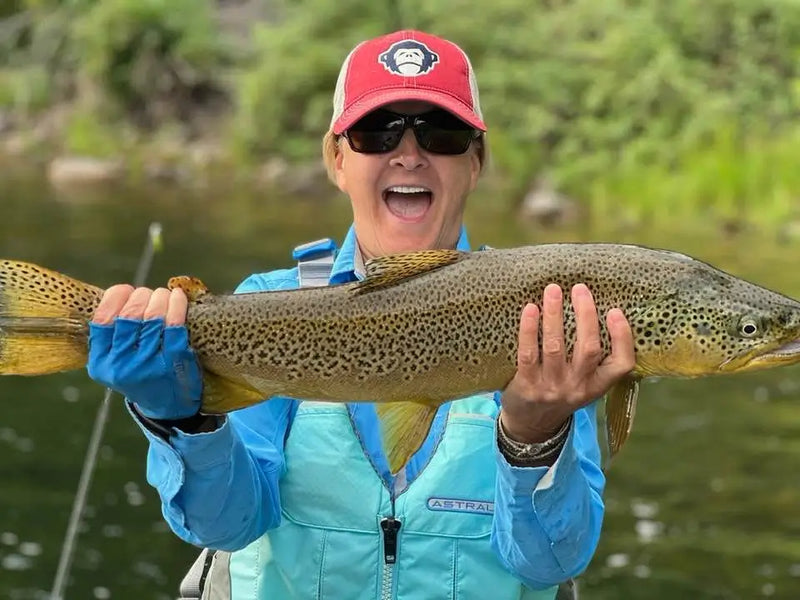 Angler holding a large trout