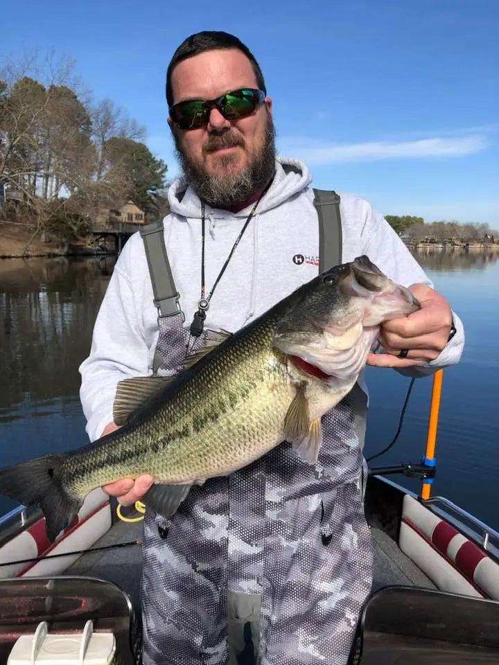 Angler holding a large bass