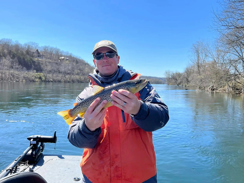 Angler holding a large trout