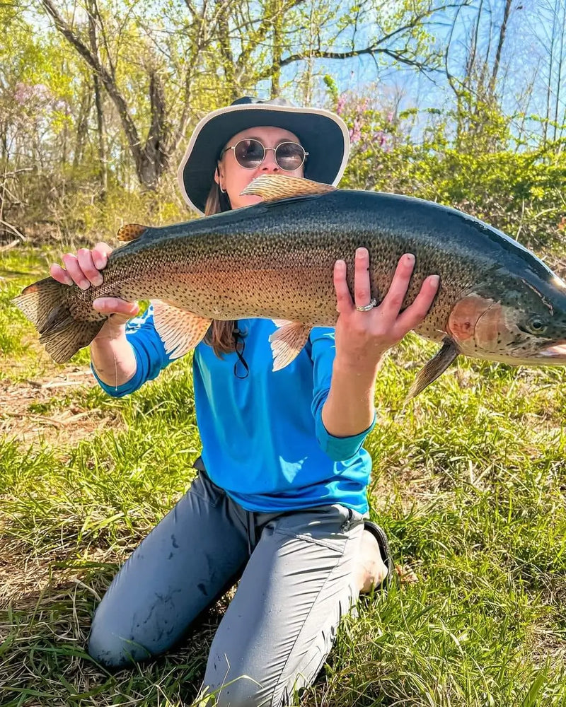 Angler holding a large trout