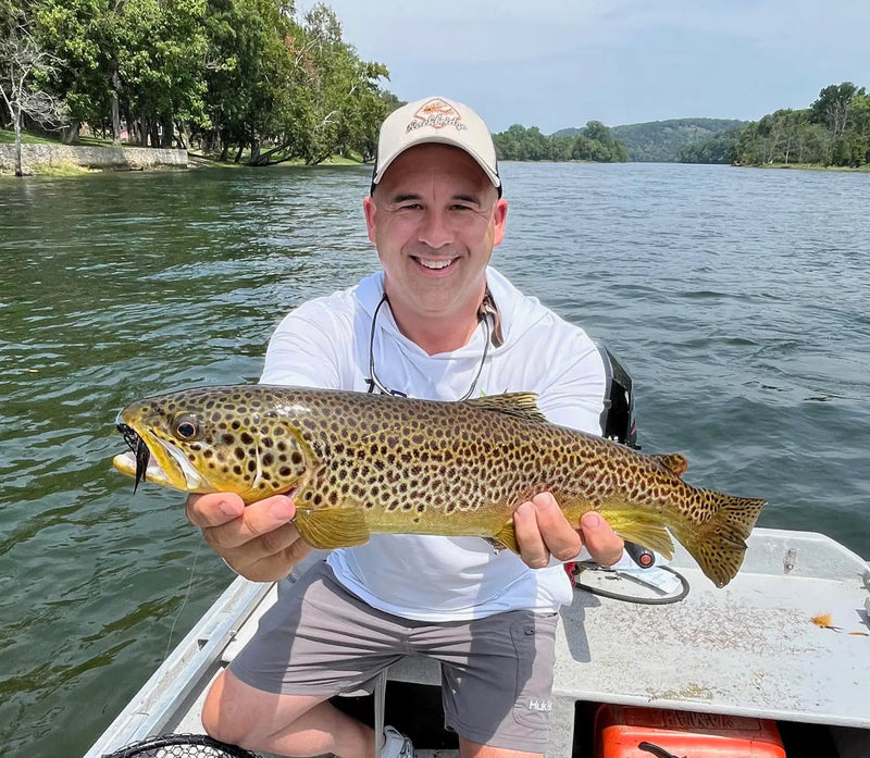 Angler holding a large trout