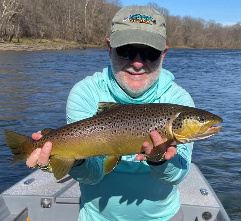 Angler holding a large trout