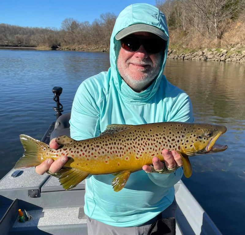 Angler holding a large trout