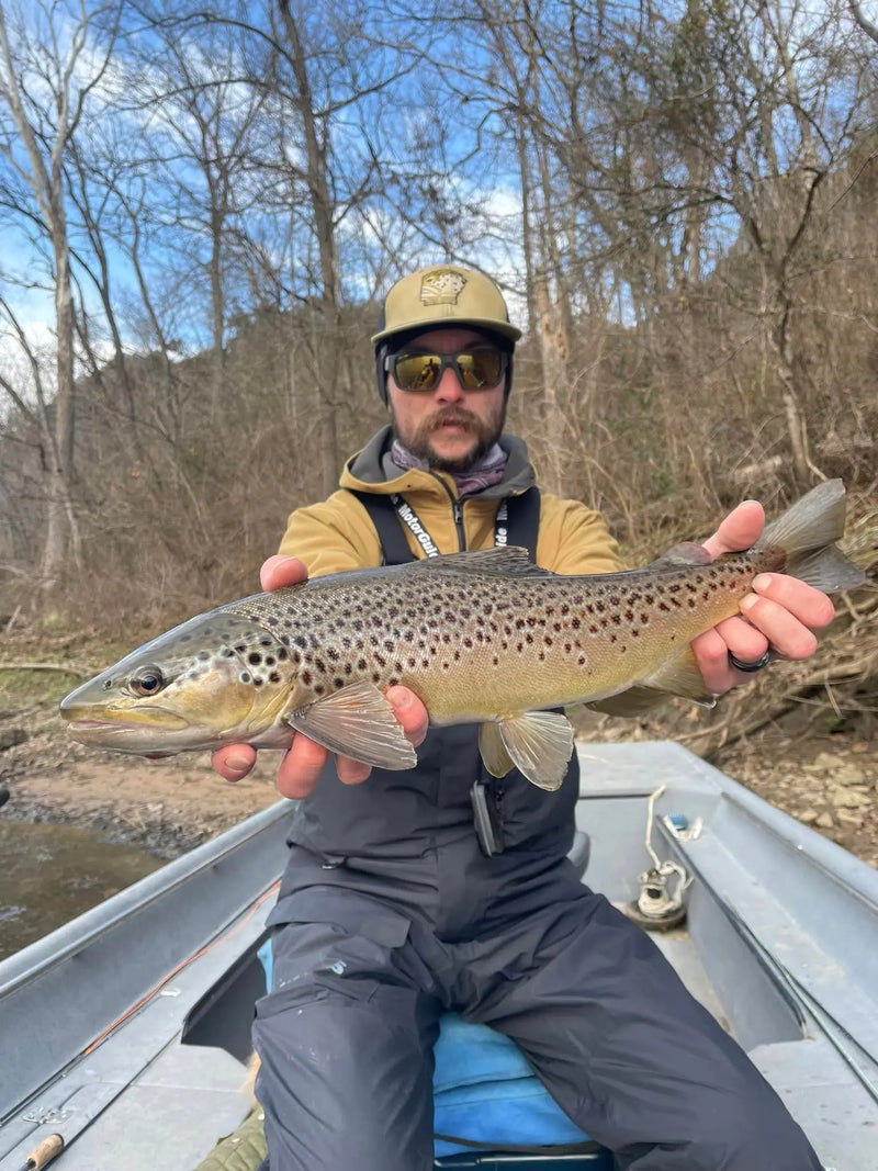 Angler holding a large trout