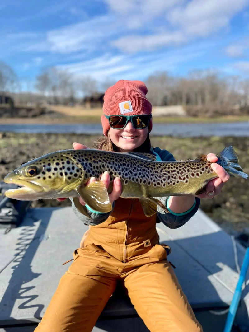 Young angler holding a large trout