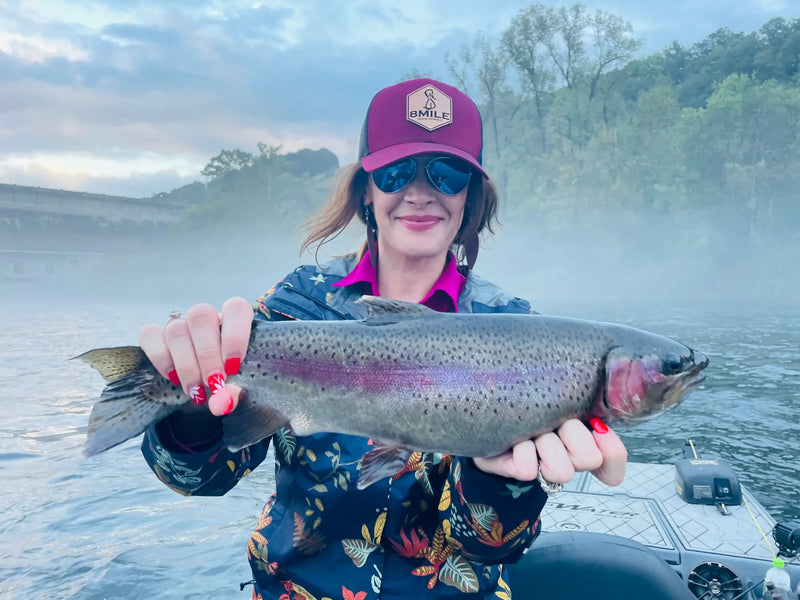 Angler holding a rainbow trout